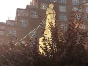 Protesters pull down the statue of Christopher Columbus in Baltimore, Maryland, U.S., July 4, 2020, in this still image obtained from a social media video. (SPENCER COMPTON/via REUTERS)