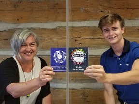 Lisa Grills and Matthew Watters show off their passports Ð the event as Grills remembers it from 1984 and how residents will get to experience it in 2020.Curbside Culture takes place in the city on July 10, 11 and 12.
SUBMITTED PHOTO