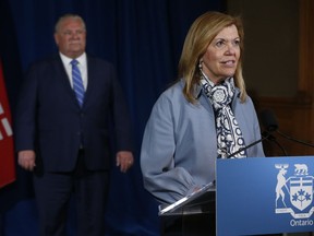 Ontario Health Minister Christine Elliott, with Premier Doug Ford in the background, encouraged residents to remain diligent in practising social distancing and hygiene as Ontario moves to the third phase in reopening following the COVID-19 pandemic.
POSTMEDIA
