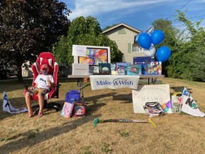 Nash McDonald poses with the computer and various other items he received Friday from the Make A Wish Foundation. The nine-year-old recently completed his treatment for a rare form of lymphoblastic leukemia.
VIRGINIA CLINTON