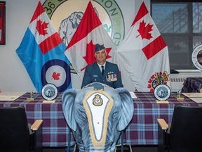 Lieutenant-Colonel James Brown is joined by Colonel Ryan Deming, 8 Wing Commander, as he takes command of 436 Transport Squadron from Lieutenant-Colonel Andy Bowser during a signing ceremony at 8 Wing Trenton late last week. 
PRIVATE NATASHA PUNT