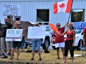 About two dozen protesters voiced Thursday their displeasure with the federal government at Belleville offices of Bay of Quinte MP Neil Ellis regarding a range of issues including recommendations that non-medical masks be worn to stem the spread of COVID-19. DEREK BALDWIN