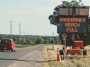 Electronic road signs are being posted in Prince Edward County to advise motorists heading to Sandbanks Provincial Park of midday beach closures when the park reaches full capacity. It's hoped advance notice will turn away growing line-ups stranded on roads near the entrance when the park suddenly closes for the day. SANDBANKS PROVINCIAL PARK/TWITTER