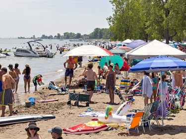 The main public beach at Turkey Point was at capacity for visitors by 1 p.m. on Saturday July 4, 2020 as thousands flocked to beaches along the Lake Erie shoreline in Norfolk County under sunny skies and warm temperatures.  Much of the beach has disappeared in the area due to high water levels, and other area beaches remain closed compounding concern about over-crowding. Brian Thompson/Brantford Expositor/Postmedia Network