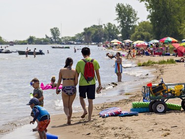 The beach at the west end of Turkey Point, with no public parking and used primarily by cottage owners, was less crowded compared to the main public beach on Saturday July 4, 2020. Thousands flocked to beaches along the Lake Erie shoreline in Norfolk County under sunny skies and warm temperatures.  Much of the beach has disappeared in the area due to high water levels, and other area beaches remain closed compounding concern about over-crowding. Brian Thompson/Brantford Expositor/Postmedia Network