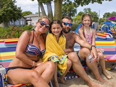 Kasia and Robert Devlin of Brampton, with their friends' children Summer-Lynn Towns, age 9 (centre) and her cousin Haleigh Towns, 9 of Brantford enjoy the sunshine and breeze at the beach at Turkey Point, Ontario on Saturday July 4, 2020. Brian Thompson/Brantford Expositor/Postmedia Network