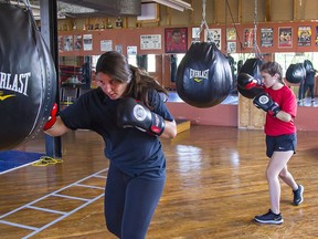 Nikita Abbott (left) and Keslie MacPhee train at Black Eye Boxing in Brantford.