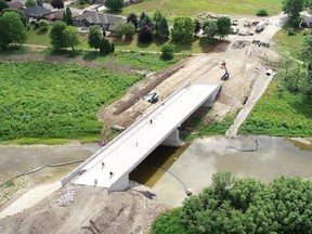 Taken from the west end, this drone image shows bicyclists travelling the $3.9 million Henry Street bridge in Mitchell. Work began in May 2019 and will be open to all traffic, perhaps as early as mid-September, six weeks ahead of schedule. KEVIN MASCHKE