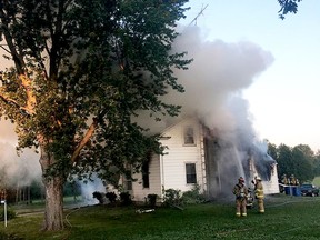 Firefighters battle a blaze on County Road 8 on Canada Day morning in this image provided by Elizabethtown-Kitley Fire Chief Jim Donovan. (SUBMITTED PHOTO)