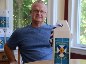 Retired OPP sergeant Craig McCormick, deeply shaken by the tragic events of the shooting rampage in Nova Scotia last April, felt the need to reach out to the victims' families and friends. Here, McCormick is shown at his home with one of the buoys he's designed and made to raise funds for the families.
Heddy Sorour/Local Journalism Initiative/The Recorder and Times