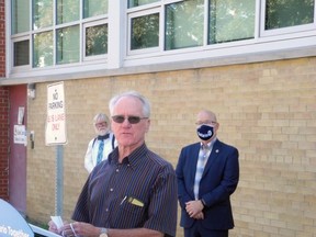 School board chair John McAllister acknowledges the $3.2 million for Westminster School as trustee John McCrea (left) and MPP Steve Clark listen in the background. Wayne Lowrie/Recorder and Times