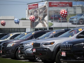 Vehicles for sale are shown July 3, 2020, at Motor City Chrysler in Windsor.