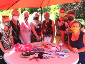 These members of the Grandees normally do charitable work to help grandmothers in Africa, but during the COVID-19 pandemic they have used their sewing talents to make everything from cloth face masks to fidget quilts, that have been donated to various organizations in Chatham-Kent. Pictured from left is: Barb Howe, Valerie Lancaster, Sharon Tranter, Chris Crouch, Anne Coulter, Dianne Blonde, Mary Lou Kearney and Anne Gibson. (Ellwood Shreve/Chatham Daily News)