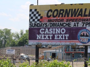 The speedway billboard, with the pit area and bleachers in the background. The pits will be busy but the stands empty, when racing resumes on Saturday. Photo on Tuesday, July 7, 2020, in Cornwall, Ont. Todd Hambleton/Cornwall Standard-Freeholder/Postmedia Network