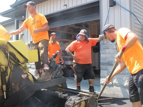 On a job site for Spooner Paving are (from left) Jack Spooner, Adam Kerr, Marc Hannan and Mike Spooner. Photo on Friday, July 10, 2020, in Cornwall, Ont. Todd Hambleton/Cornwall Standard-Freeholder/Postmedia Network