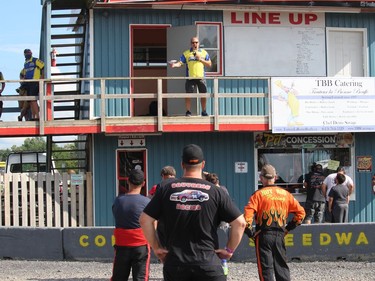 Race director Joel Doiron with some instructions for drivers before the event got underway. Usually, there's a big crowd of drivers at the base of the tower, but these days, it's requested they stay at their respective trailers in the pits. Photo on Sunday, July 12, 2020, in Cornwall, Ont. Todd Hambleton/Cornwall Standard-Freeholder/Postmedia Network