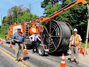 Public officials came together to mark the installation of fibre-optic cable in the Wilsonville-Waterford area on July 15. Among those on hand were Haldimand-Norfolk MPP Toby Barrett (left), Port Rowan Coun. Tom Masschaele, and South-West Oxford Mayor David Mayberry, chair of the South-Western Integrated Fibre Technology (SWIFT) initiative. Handout