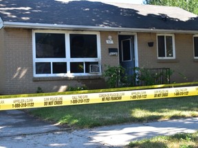Fire damage at 47 Bennet St. East in Goderich included charring and a broken window on July 24. Unmarked OPP vehicles sit out front of the house. Daniel Caudle