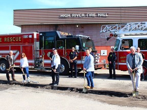 Members of High River Town Council and the High River Fire Department stand by as shovels hit the ground on June 22, officially commencing the long-awaited renovations to the High River fire hall.