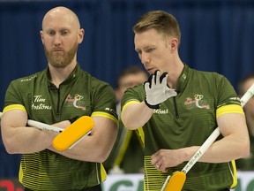 Team Northern Ontario skip Brad Jacobs (left) and third Marc Kennedy discuss strategy at the 2020 Tim Hortons Brier