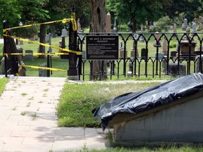 ingston Police are currently investigating vandalism to two plaques at the gravesite of Sir John A. Macdonald in Cataraqui Cemetery that occurred on Canada Day. (Meghan Balogh/The Whig-Standard)