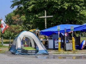 To combat the heat wave, residents of the Belle Park encampment fashioned a tent into a cooling area with fans, a mister and an air mattress. (Matt Scace/For The Whig-Standard)