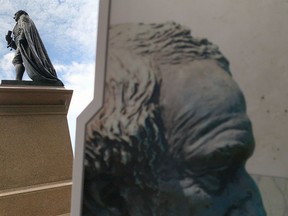 The plaque book at Sir John A. Macdonald's statue in city park may be removed and replaced with information that includes an Indigenous perspective of Canada's first prime minister. (Elliot Ferguson/The Whig-Standard)