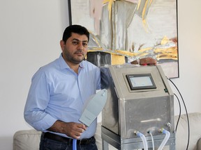 Hasan Kettaneh in his living room next to his completed ventilator prototype. He spent more than four months working on the ventilator, which he hopes to get tested in the near future. (Matt Scace/For The Whig-Standard)