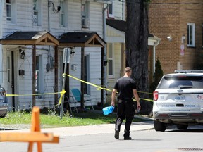 Kingston Police investigate a serious assault near the intersection of Division and Pine streets in Kingston, Ont., on Tuesday, July 28, 2020.