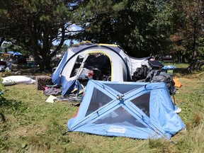 The city estimates that about 90 people are living in encampments around the city, including Belle Park. (Elliot Ferguson/The Whig-Standard)