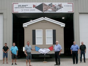 Exeter's Northlander Industries celebrated the production of its 20,000th unit on July 21. Also attending were the owners of Pike Lake Trailer Sales, which bought the unit. From left are Shawn Cowen, Tom Cowen and Herb Cowen of Pike Lake, Northlander owner/president Bob Hamather, and Northlander's Wayne Hamather and Jason Brown.