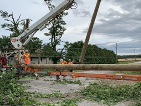 Crews work to replace fallen hydro poles on a line running along Highway 4 near Centralia. An EF1 tornado was confirmed north of Lucan. Dan Rolph