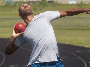 London olympian decathlete Damian Warner works on his glide during a little shot-put practice on Friday, July 17, 2020, with his coach Gar Leyshon. Warner is trying to maintain fitness, work on his strengths, improve weaknesses and stay healthy while waiting for the Olympics postponed until 2021. (Mike Hensen/The London Free Press)