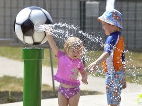Will Courtney, 4, and little sister Maeve, 2, work one of the water features together at the West Perth Splash Pad last July, trying to beat the heat. The municipality plans to have the splash pad ready for use once outdoor activities are allowed with the Lions Pool opening targeted for June 4. ANDY BADER/MITCHELL ADVOCATE