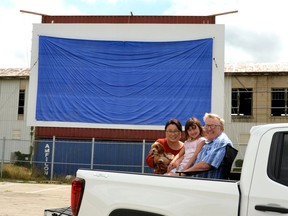 Local filmmaker Craig Thompson, his wife Koi, daughter Jaden, and their dog, LuLu, are parked in front of the new drive-in theatre in the Cooper parking lot in Stratford.
(GALEN SIMMONS, Beacon Herald)