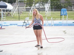 Haley Stark was seen washing down the pool's deck last week. The pool is open for limited activities.
Brigette Moore