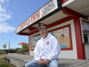 David Dobson sits in front of his restaurant at Sauble Beach in this file photo from June 17, 2019.
 Scott Dunn/The Owen Sound Sun Times/file photo