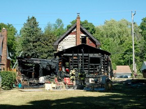 Firefighters finish up at the scene of a fire at 848 8th Ave. E. in Owen Sound Wednesday. No one was injured but the fire heavily damaged the back of the house and destroyed the garage.
(Scott Dunn/The Sun Times/Postmedia Network)