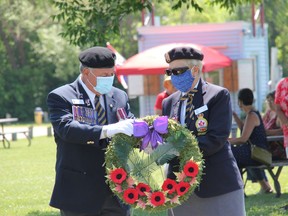 Pembroke Legion Branch 72 President Stan Halliday and Ladies Auxiliary President Evelyn Giroux prepare to lay a wreath at the waterfront during a remembrance ceremony on Canada Day. Anthony Dixon