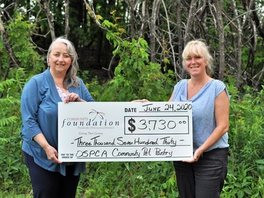 Heather Jobe, community development co-ordinator for the Ontario SPCA Renfrew County Animal Centre (right) accepts a donation of $3,730 from the PPDCF from its executive administrator and community liaison Debbie Ryan. Submitted photo