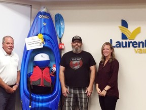 Paul Tyson (centre) was the winner of the 2019 LV Gnome contest. He won a kayak package, which was presented by Laurentian Valley Mayor Steve Bennett and Navada Sargent, township planning and recreation co-ordinator. This year's contest kicks off July 13.