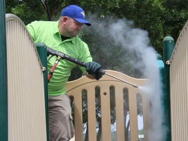 Brady Lacroix uses a high heat steam pressure washer as part of the sanitizing process used to make the City of PembrokeÃ¢â‚¬â„¢s playground equipment safe to open to children. Anthony Dixon