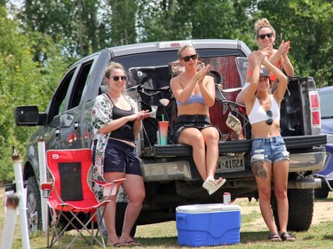 A pick-up truck load of River Town Saints fans applaud during the July 17 concert at the Skylight Drive-In in Pembroke. Anthony Dixon