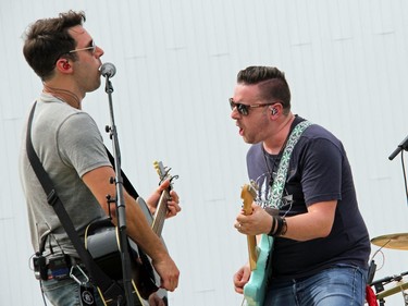 Guitarists for the River Town Saints, Chris McComb (left) and Jeremy Bortot rock out on stage at the Skylight Drive-In in Pembroke. Anthony Dixon