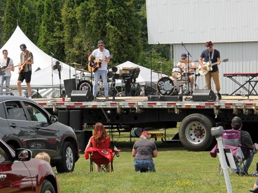 Some concert goers stayed in the cars, others opted for lawn chairs and still others, blankets on the ground, when Lemon Cash (pictured) and River Town Saints played the Skylight Drive-In in Pembroke. Anthony Dixon