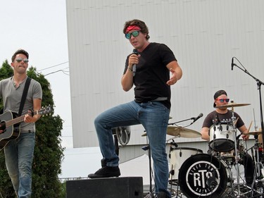 River Town Saints lead singer Chase Kasner, guitarist Chris McComb and drummer Jordan Potvin on stage at the Skylight Drive-In in Pembroke. Anthony Dixon
