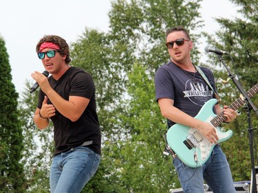 River Town Saints lead singer Chase Kasner, and guitarist Jeremy Bortot perform one of their hits at the Skylight Drive-In in Pembroke during the fundraising concert for the Robbie Dean Centre. Anthony Dixon