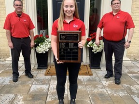 Josie Murray, the latest recipient of the Stratford Concert Band's Mervin Doerr Scholarship, aspires to share similar traits with the man who was a role model for younger musicians before his death 23 years ago. Also pictured are Stratford Concert Band conductor Laurence Gauci, left, and president Allan Lee. Cory Smith