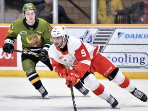 Photo provided
Soo Greyhounds defenceman Rob Calisti (right) streaks up ice in OHL action against the North Bay Battalion.