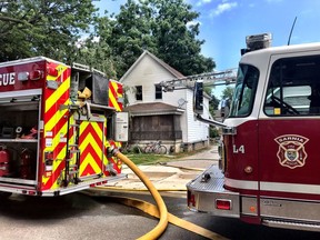 Emergency responders put out a fire on Queen Street Monday and persuaded a man barricaded inside to exit to safety, Sarnia police say. (Sarnia Fire photo via Twitter)